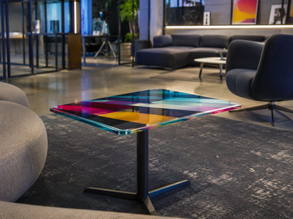Colorful glass table in a modern living room setting